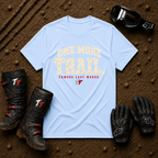 Light Blue One More Trail t-shirt with vintage varsity print and 'Famous Last Words' tagline — flat lay with muddy boots, goggles, and gloves, Tire Time Offroad