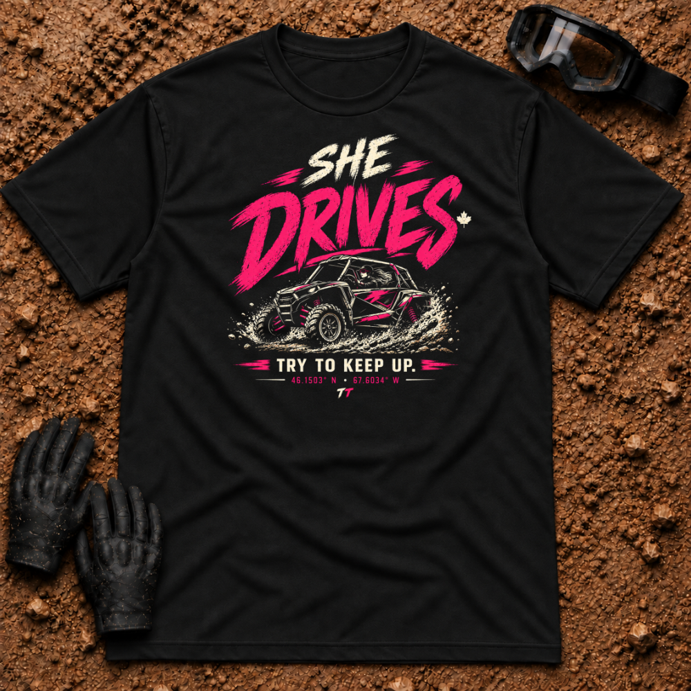 She Drives Try To Keep Up T-Shirt in Black - pink lettering over a woman driving a side-by-side UTV through dirt, Tire Time Offroad