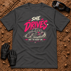 She Drives Try To Keep Up T-Shirt in Dark Heather Grey - pink lettering over a woman driving a side-by-side UTV through dirt, Tire Time Offroad