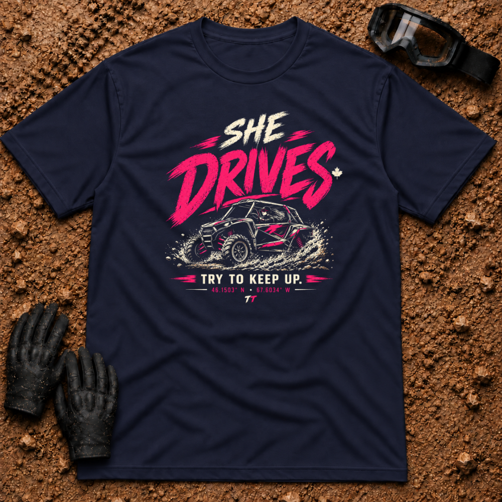 She Drives Try To Keep Up T-Shirt in Navy - pink lettering over a woman driving a side-by-side UTV through dirt, Tire Time Offroad